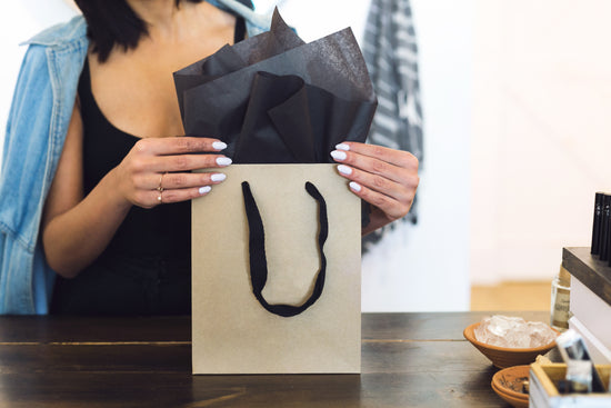 Women putting stuff in the bag